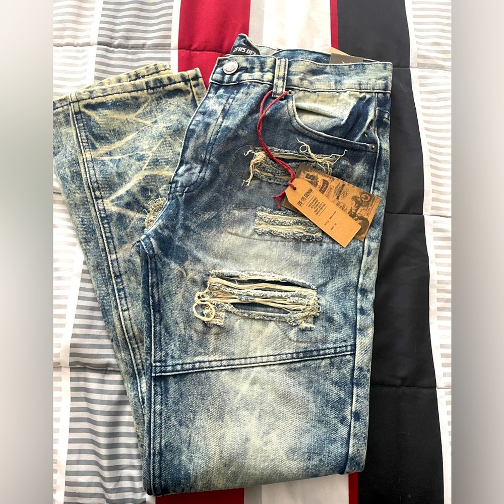 Men’s distressed moto jeans.